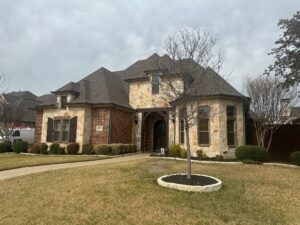 Large brick home with new shingle roof