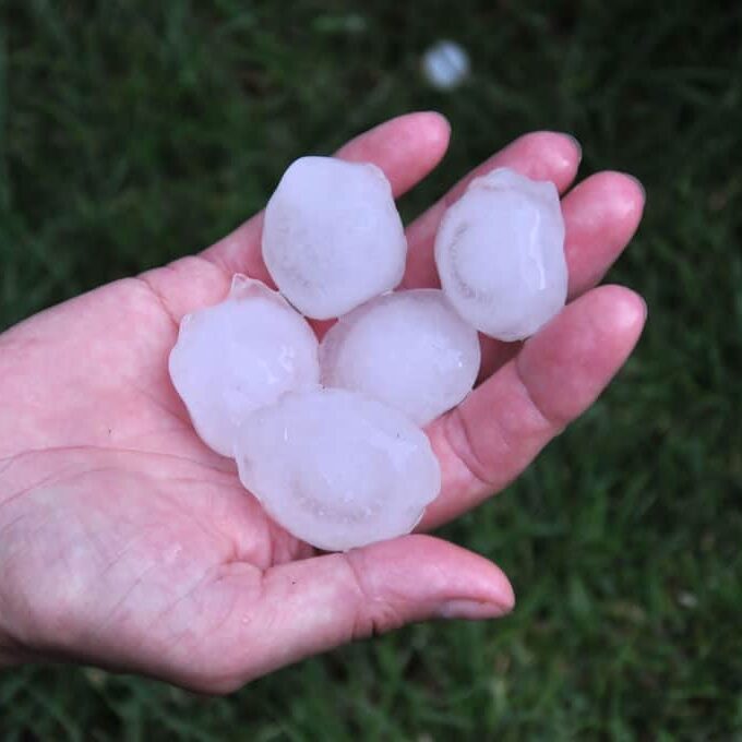 hail-balls-in-handbig Hand full of hail balls